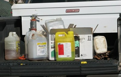 Various Chemicals Sitting in Back of a Truck